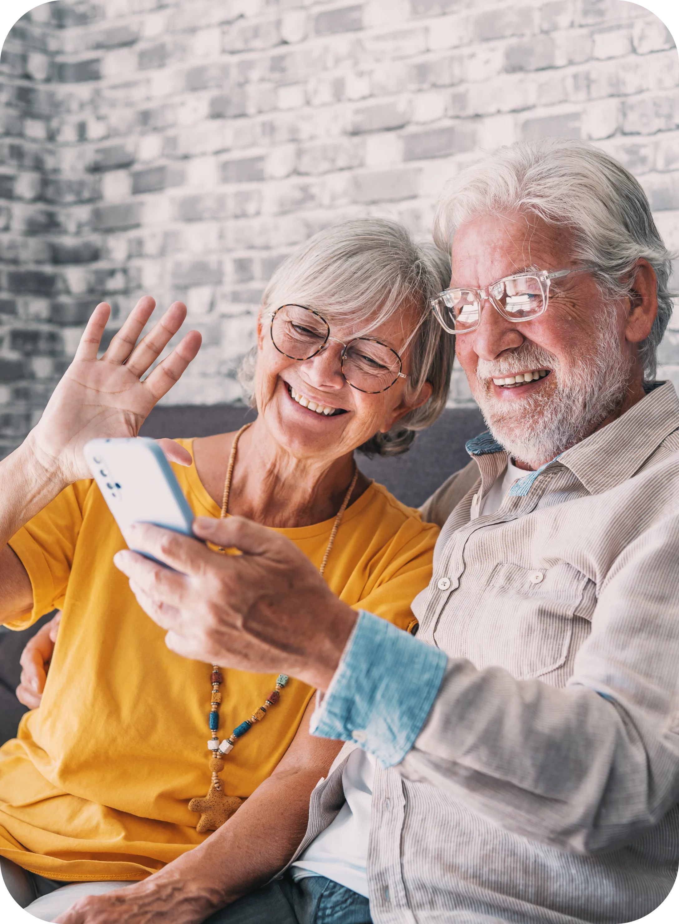 Happy couple using a phone